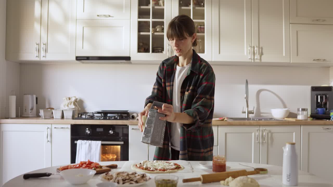 Woman grating food in kitchen