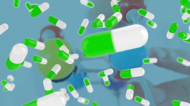 Animazione di capsule di pillole verdi e bianche che cadono sulle mani di uno studente che costruisce un modello molecolare.