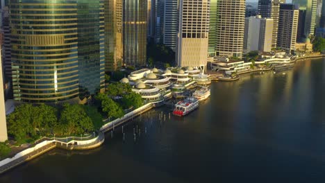 aerial view of eagle street pier ferry terminal by the river in brisbane city, australia