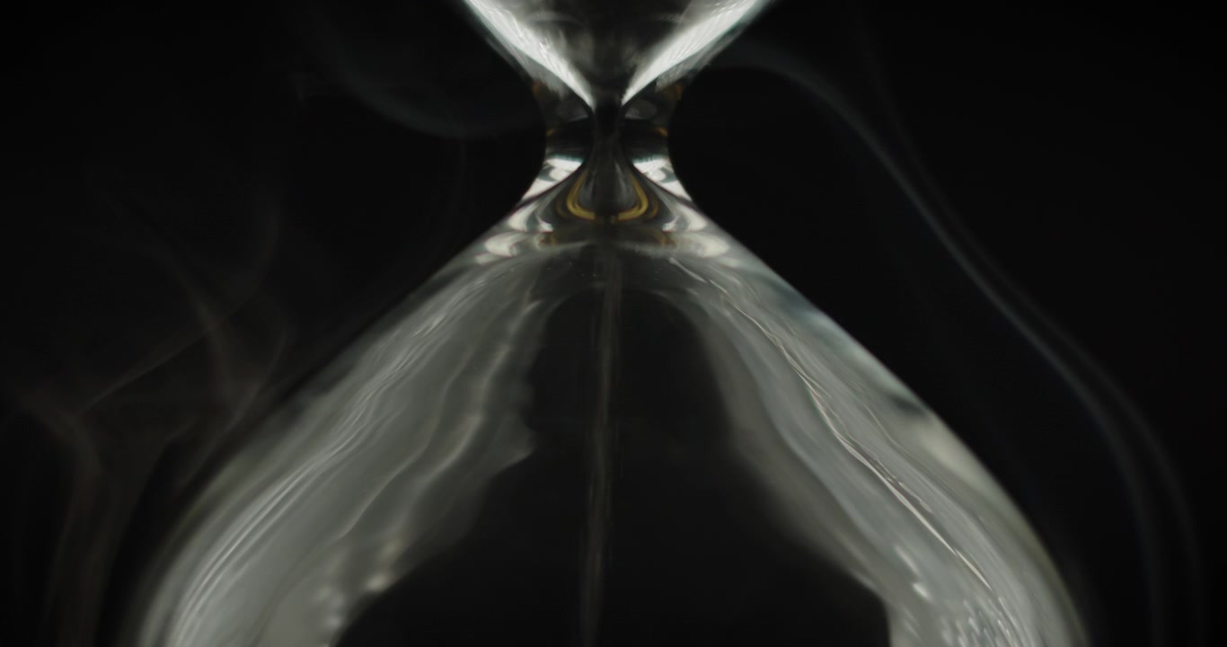 Close up of smoke wrapping an hourglass