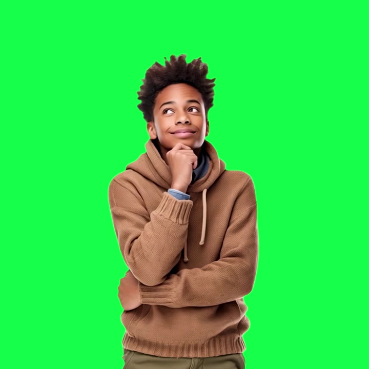 Curious Young Boy Smiling and Looking Up Thoughtfully on Green Screen
