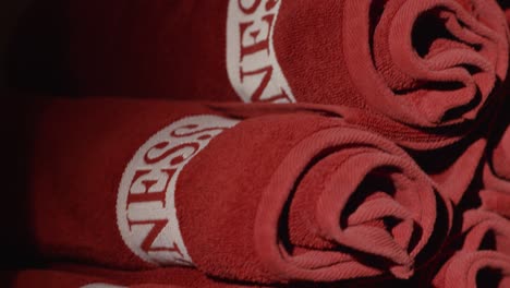 rolled-up red towels