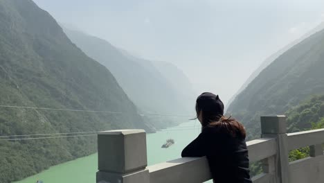 women enjoying the scenery at wujiang river viewing platform