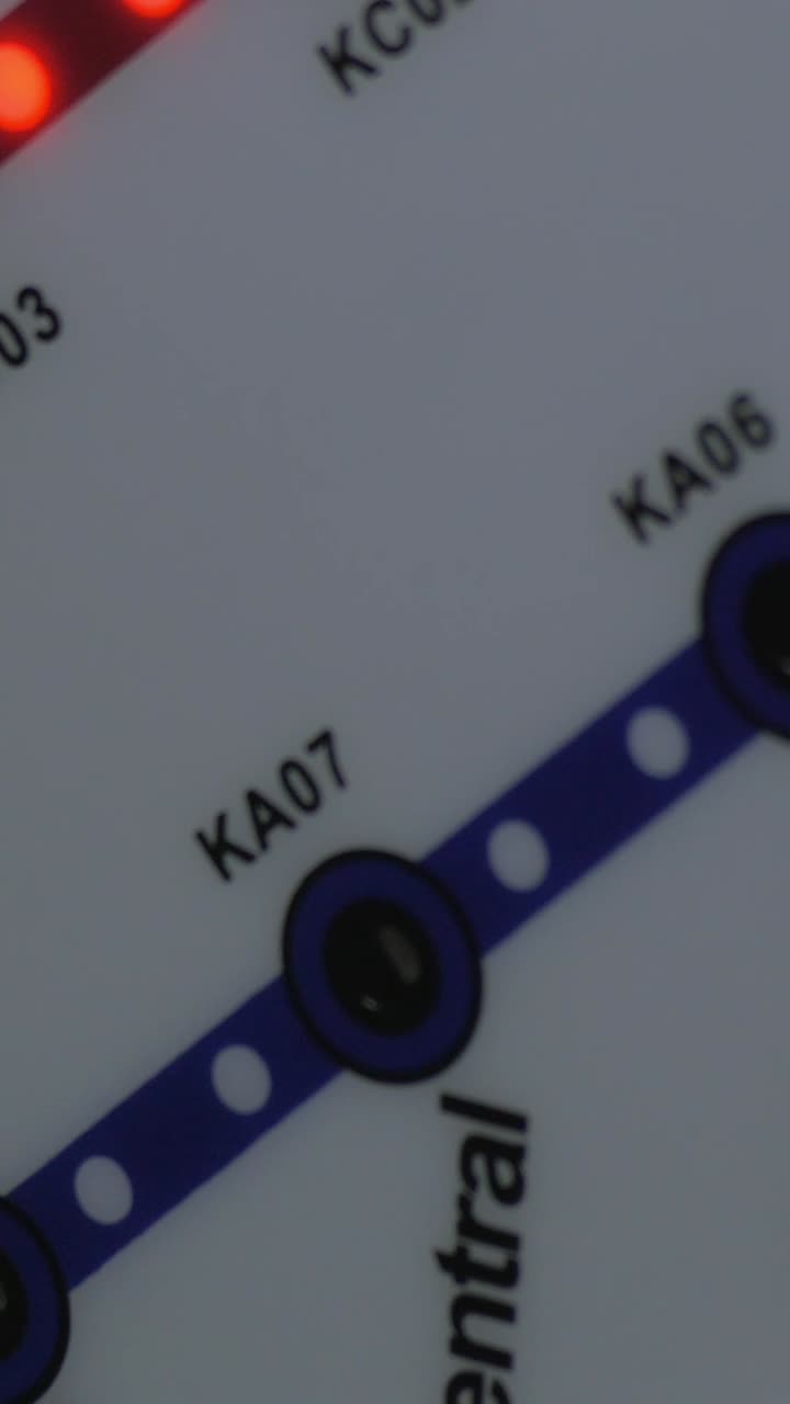Close-up of Train Map Display with Changing Station Lights
