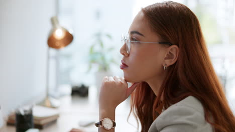 woman in glasses at desk