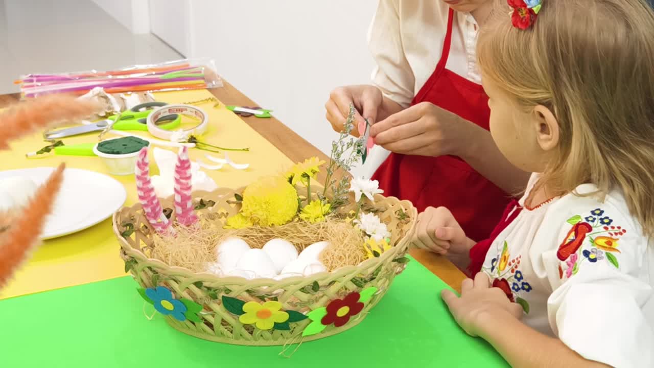 Child and Adult Making Easter Decorations