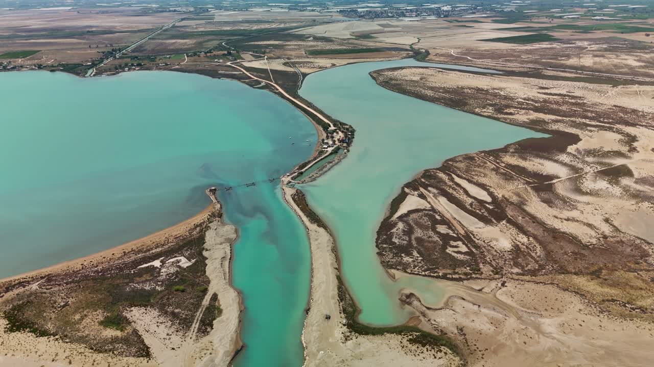 Aerial view of tranquil turquoise coastal landscape under clear skies