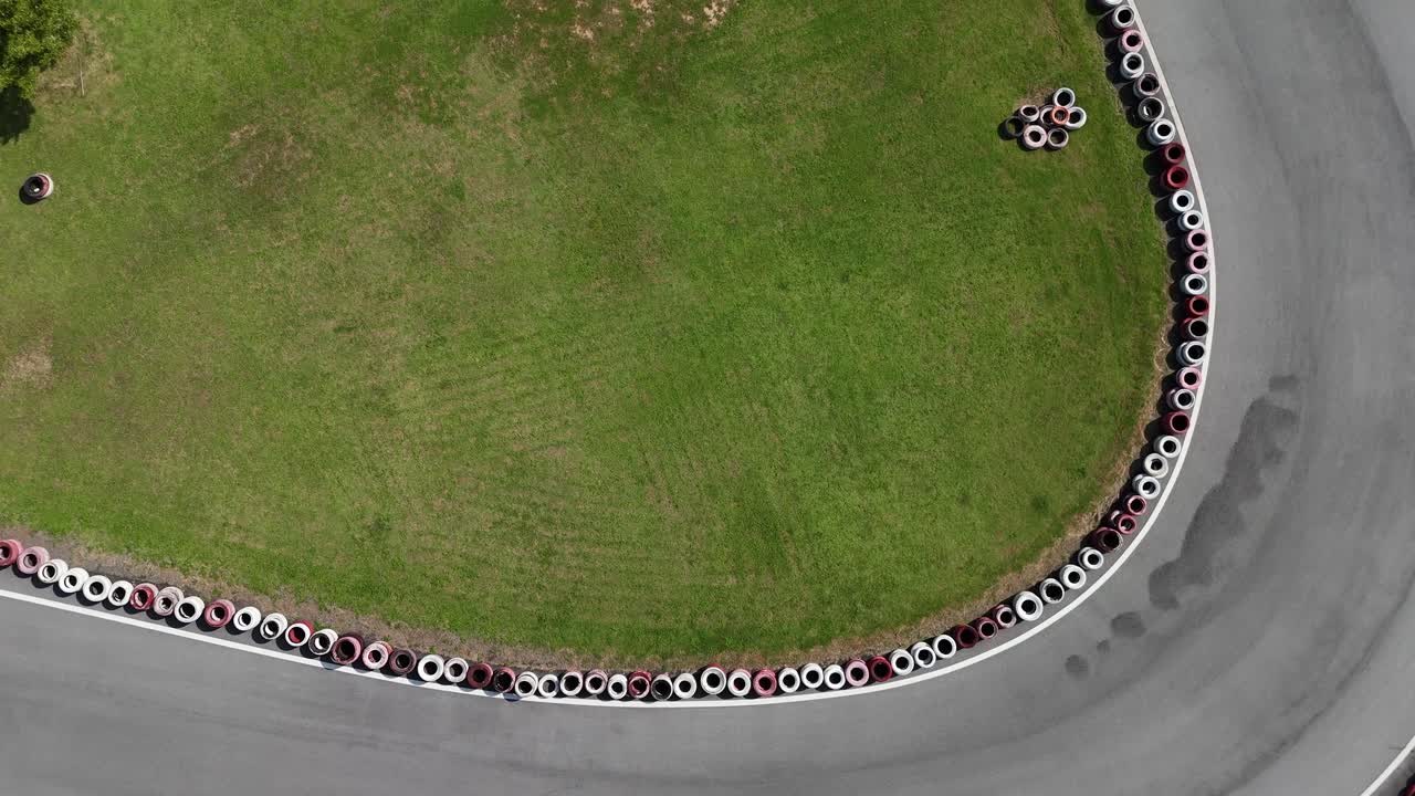 Aerial view of a racetrack with tire barriers