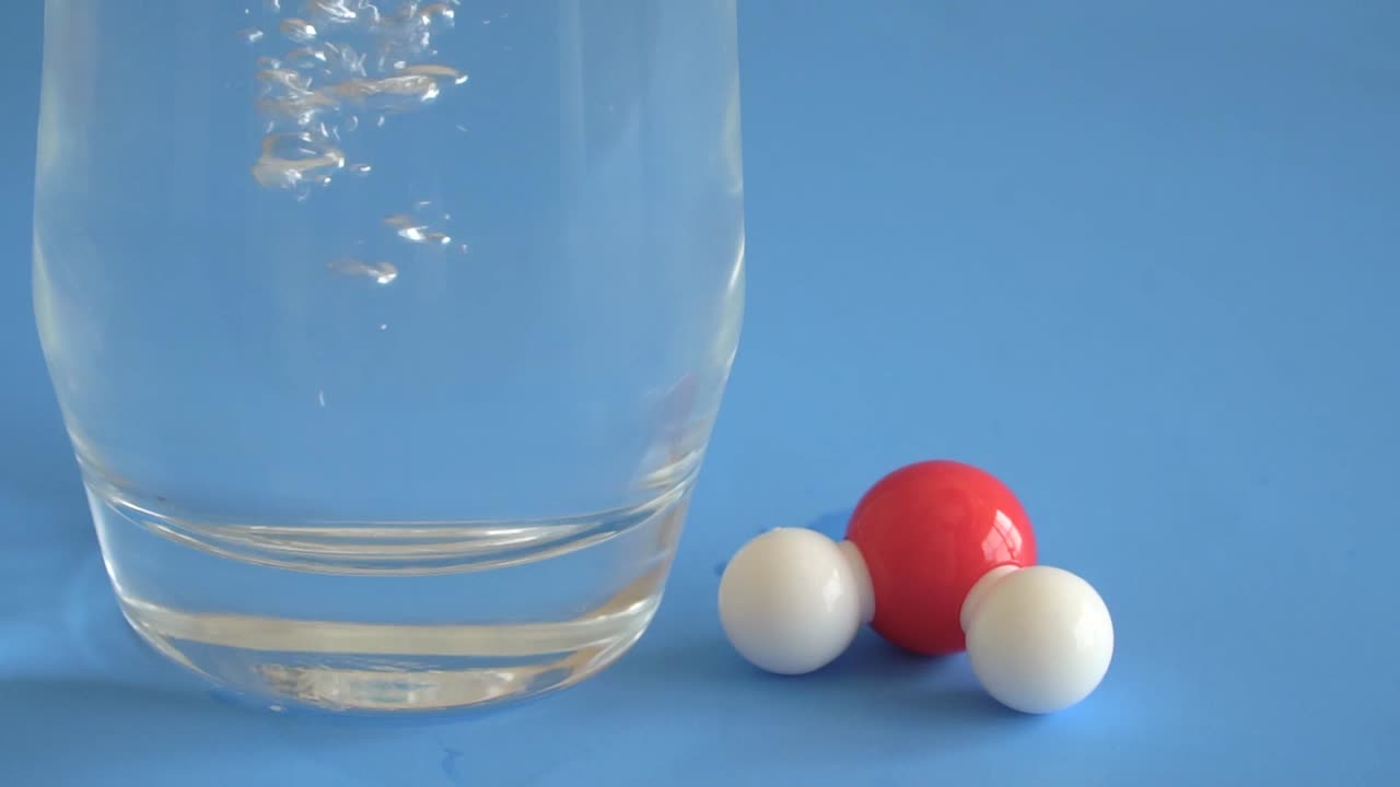 Water illustrated with a hydrogen and oxygen atom which produces a molecular structure.