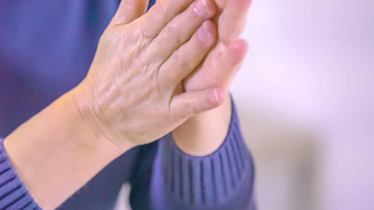 Close Up shot of a woman washing carefully her hands in times of COVID-19 pandemic
