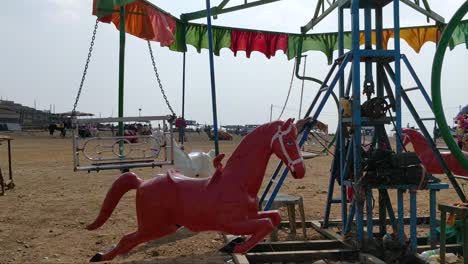 a still deserted horse carousal or merry go round at saputara gujarat india. this carousal was situated on top of a mountain land.