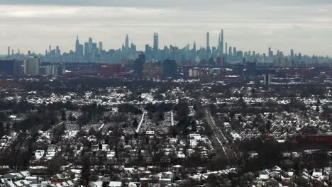 an aerial view of a suburban neighborhood after it snowed