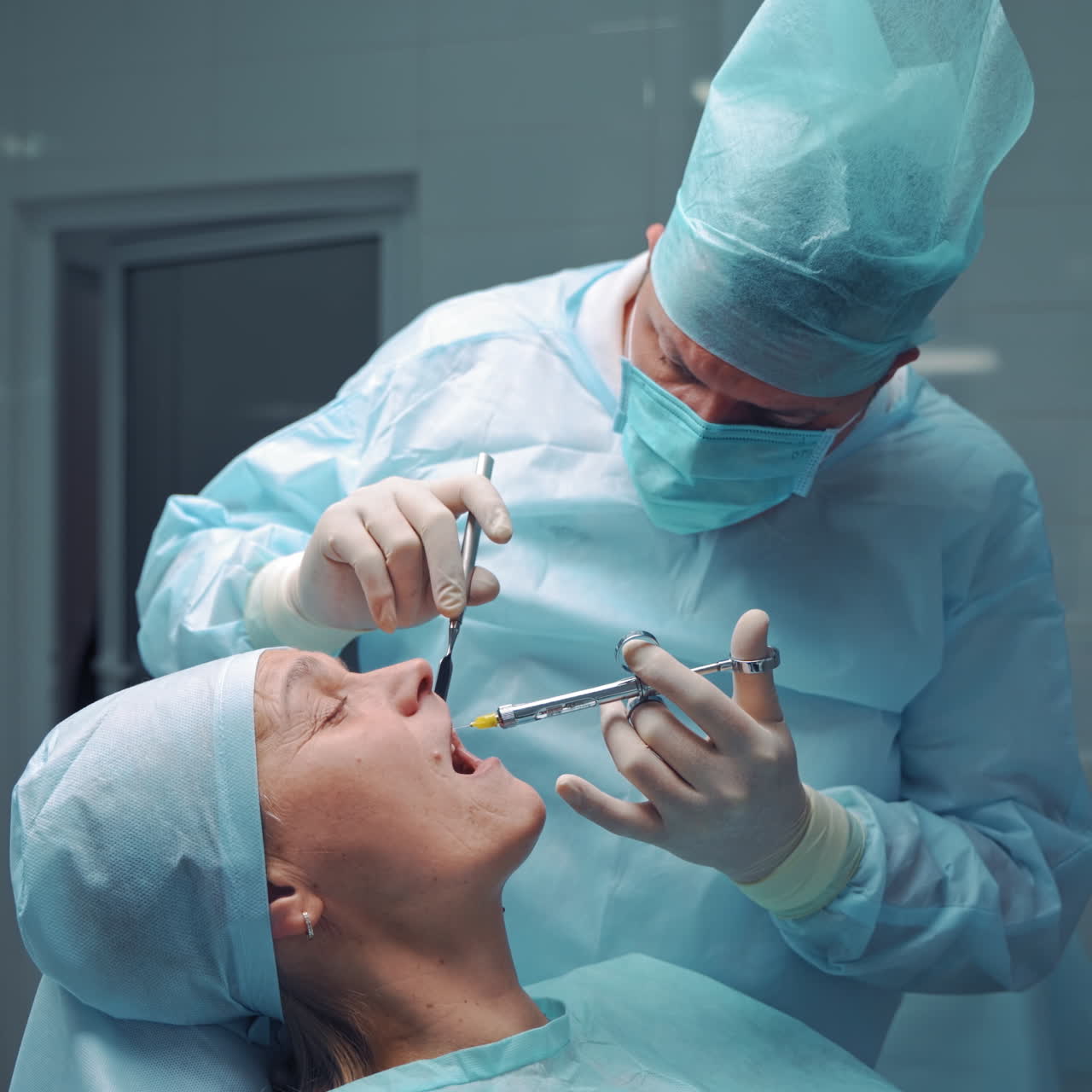 the dentist is making anesthesia to the patient