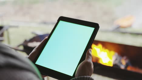 Person,-campfire-or-hands-with-mockup-on-tablet