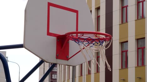 basketball hoop, basket. outside, street basketball court.