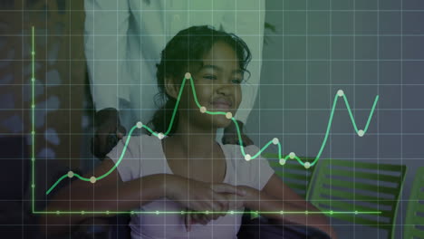 in school, child smiling with animation of green line graph showing fluctuating data