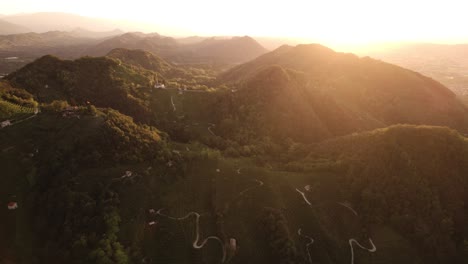 Aerial-landscape-view-over-the-famous-prosecco-hills-with-many-vineyard-rows,-Italy,-at-sunrise