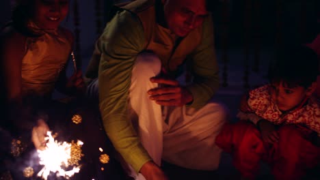 parents with kids celebrate the indian traditional festival of diwali