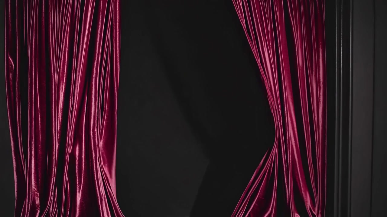 Red Velvet Stage Curtains Slowly Closing on a Dark Background