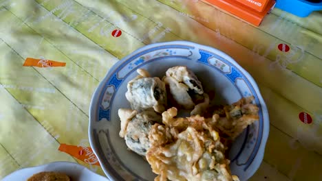 red bean soup and other indonesian food specialties on table, handheld