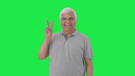 Indian-old-man-showing-victory-sign-Green-screen