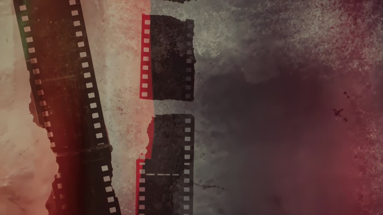 Drifting film strips rotating against gradient backdrop with shifting red light leaks, copy space