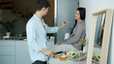 couple cooking and eating together