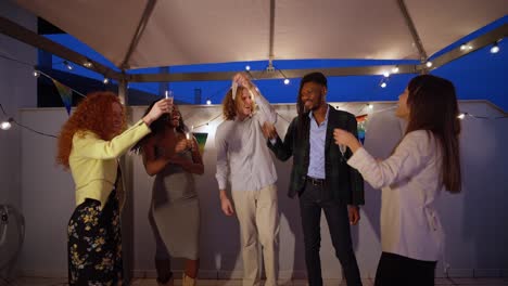 people celebrating at a rooftop party