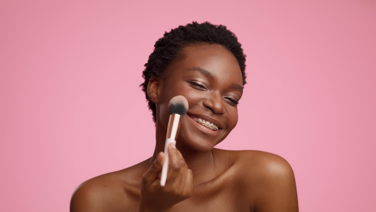 Woman Applying Blush Makeup