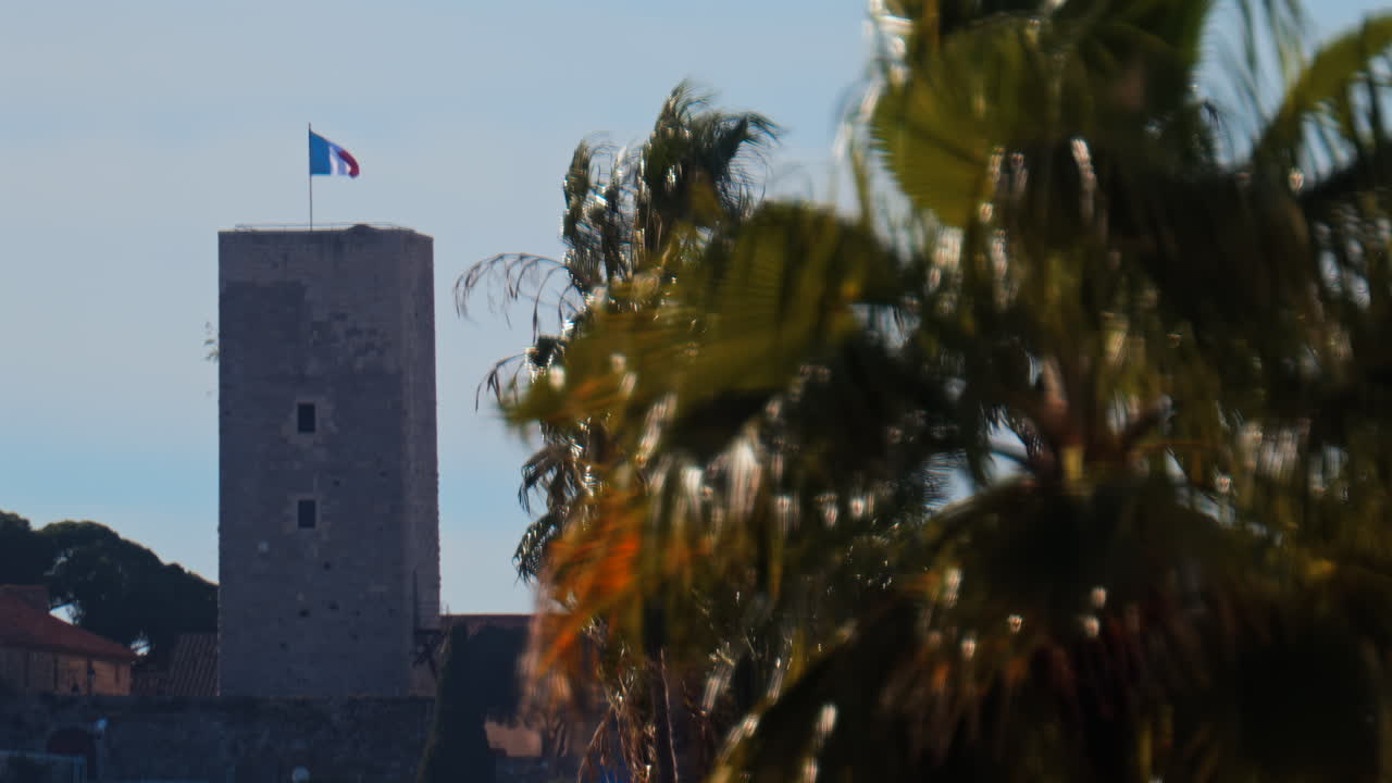Distant view of the Goya Museum in Castres, France with the french flag on top of it