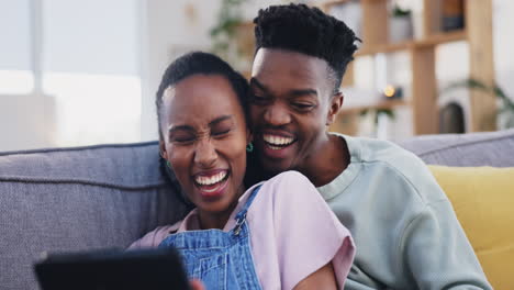 Tablet,-black-couple-and-funny-on-sofa-in-home