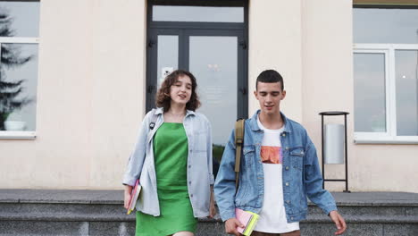 Two-friends-talking-outside-the-high-school