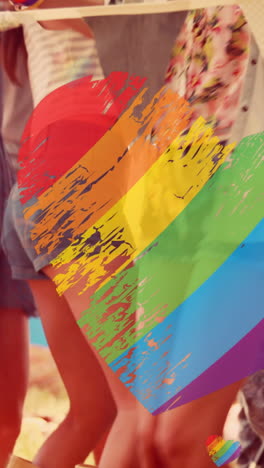animación de corazones de arco iris sobre un grupo de personas