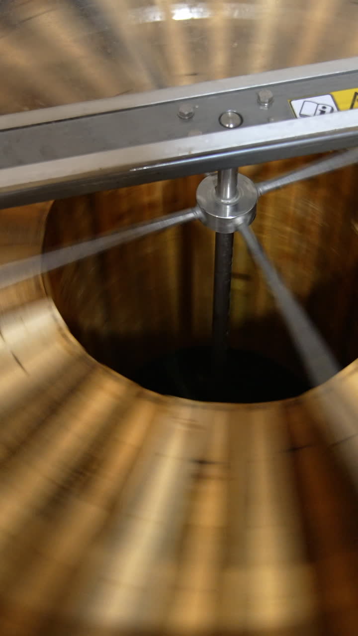 Organic food beekeeping production. Centrifuge machine for harvesting honey. Vertical video