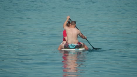 water sports slow motion, paddle-board equipment, couple fun leisure