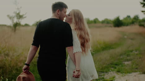 Joyful-Couple-Walking-And-Smiling-Outdoors-In-Summer-1