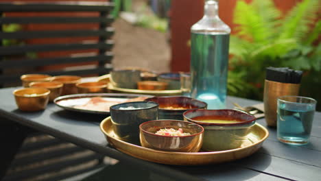 outdoor dining table with indian dishes