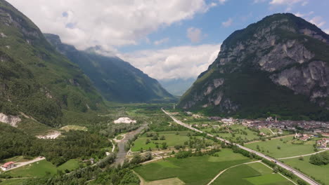 aerial view of a valley with mountains in the background