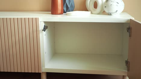 empty modern white cabinet with pink accents