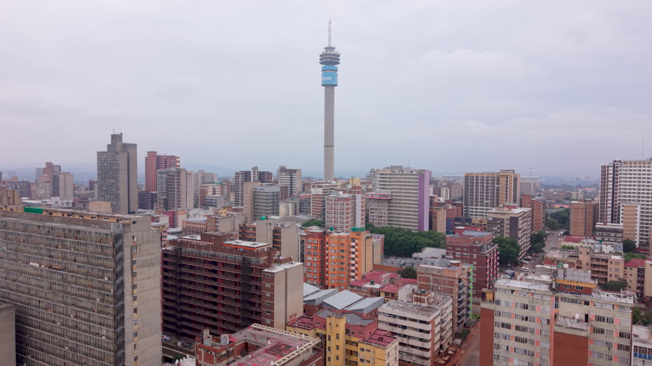 Aerial of Johannesburg and Hillbrow city buildings on overcast cloudy day