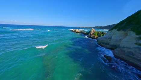 Aerial-drone-fpv-scene-over-rocky-coast-of-El-Breton-Beach-in-Dominican-Republic