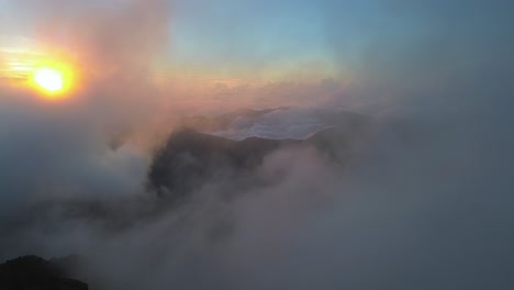 aerial footage of smoky, foggy weather at mountains of pyrenees in ibones de anayet, aragón, spain during morning