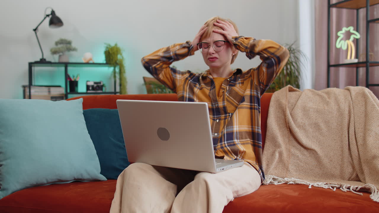 Pretty young woman use laptop surprised by bad news fortune loss fail lottery results at home