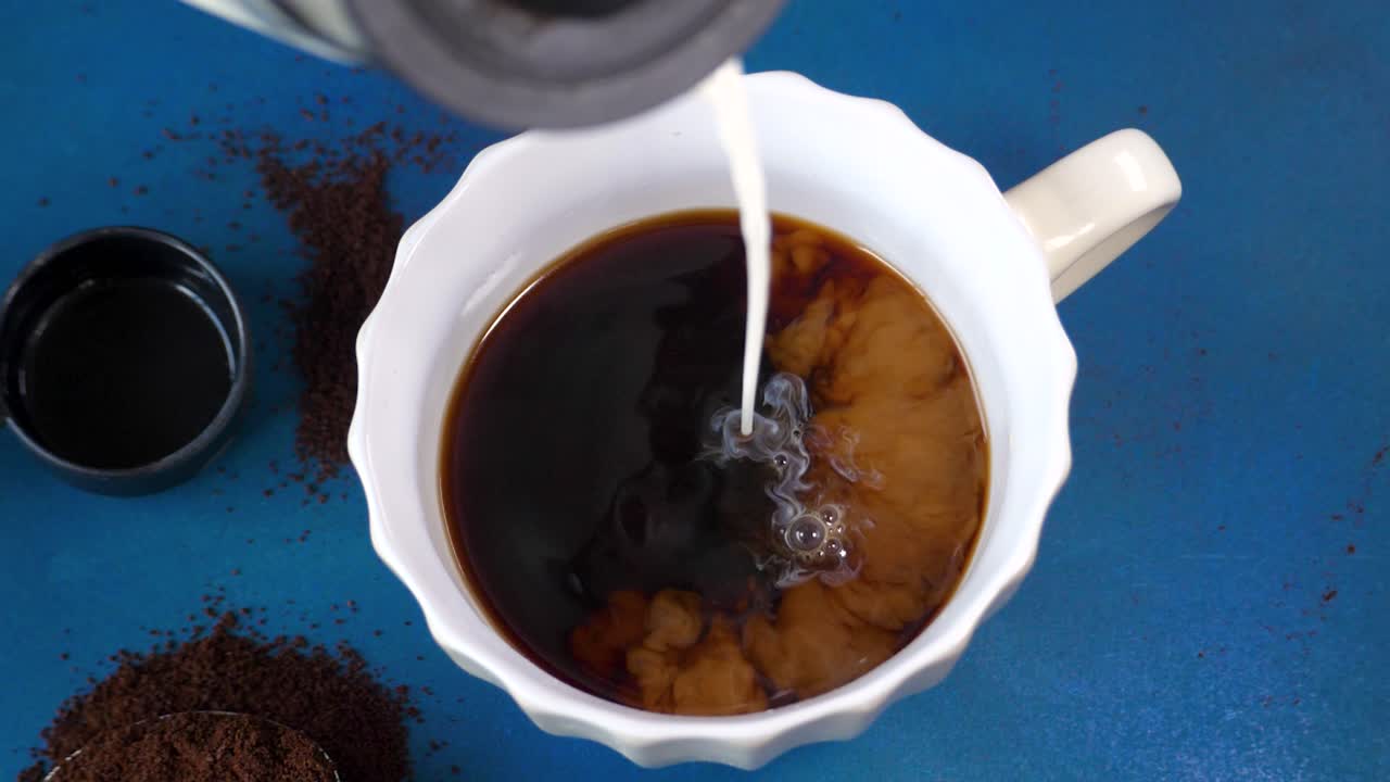 Coffee with condensed milk pouring, Slow motion