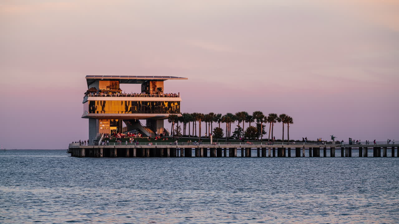 Stunning time-lapse of Saint Petersburg Pier transitioning from golden hour sunset to vibrant night lights