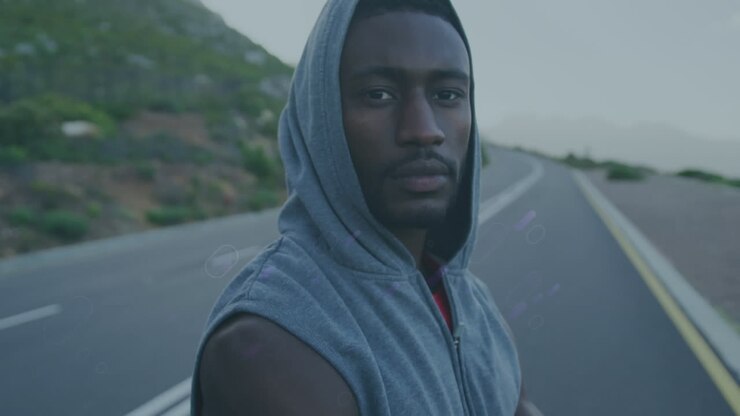 Animation of blue trails over african american male runner