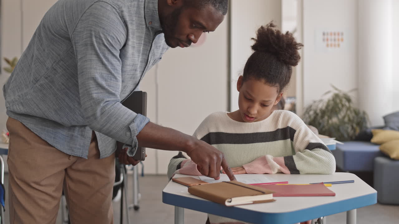 Afro American School Teacher during Class