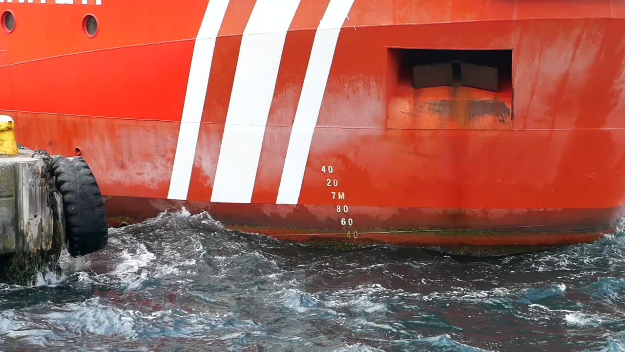 Close-up of a ship hull at a dock