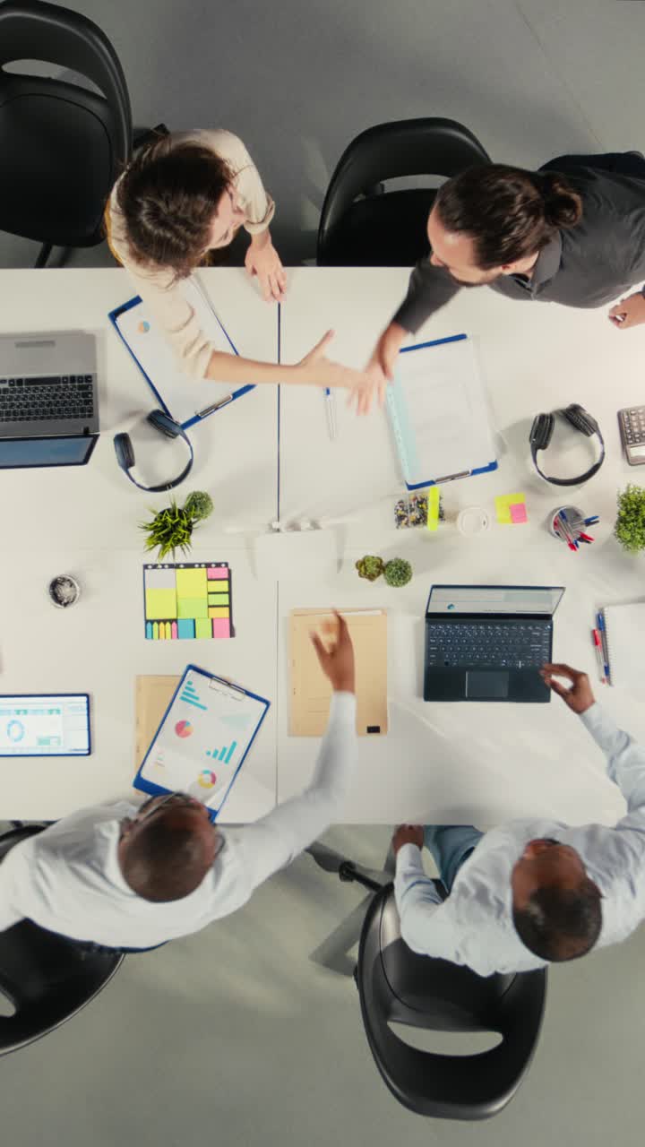 Vertical Video Top down view of business people greeting each other in office before meeting