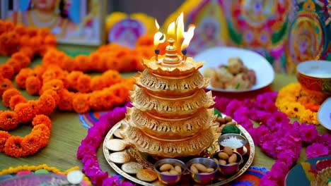 hindu religious ceremony with diya and decorations